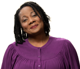 a woman wearing a purple shirt.